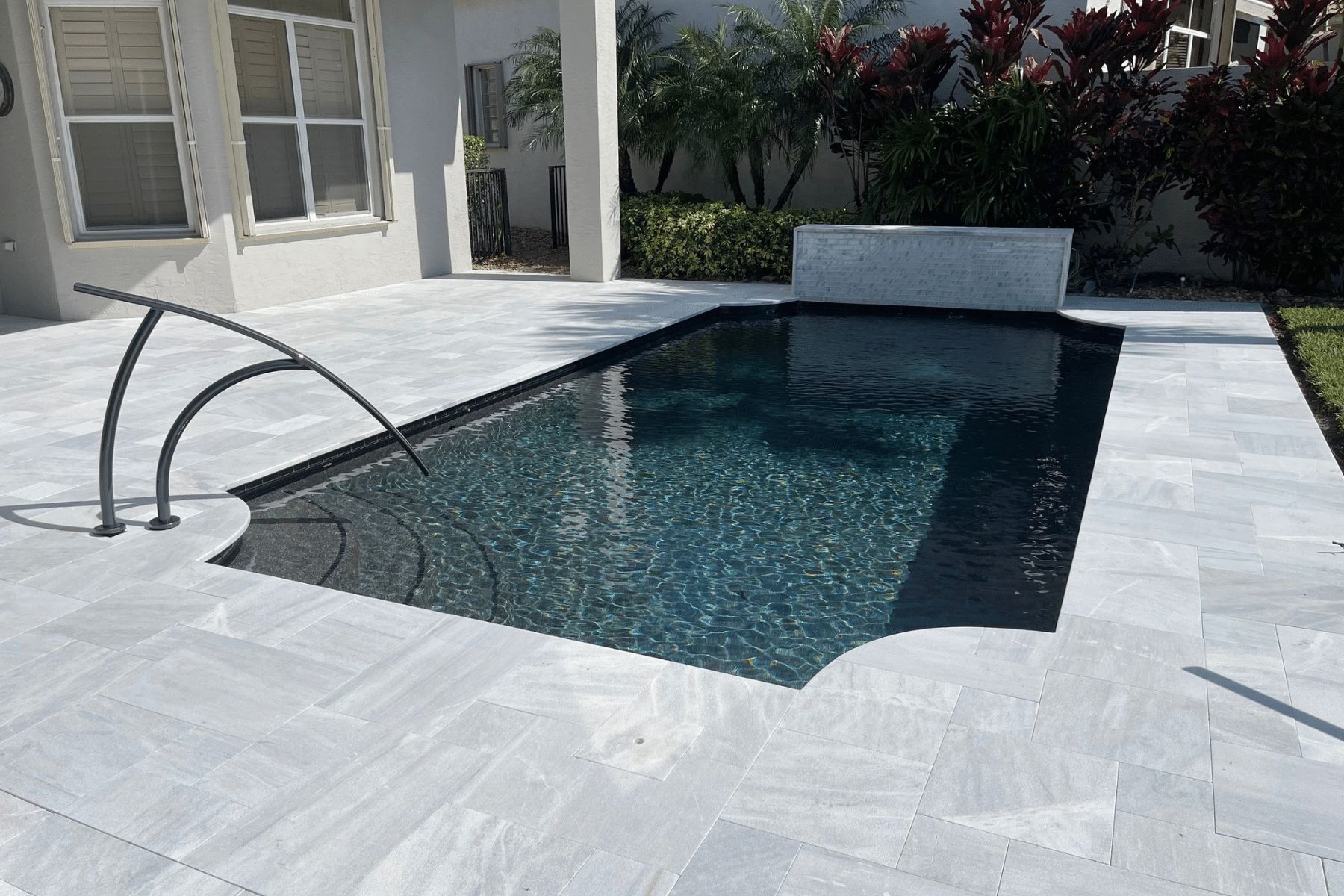 Pool Deck Surfaces Travertine Stone PUP Pavers and Turf Florida