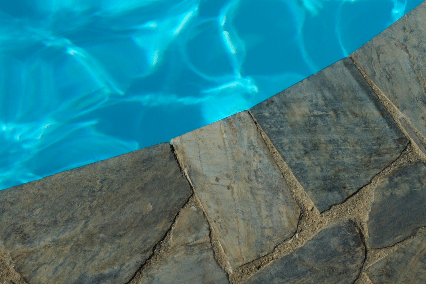 Pool Coping Pavers Installation Natural Stone PUP Pavers and Turf Florida