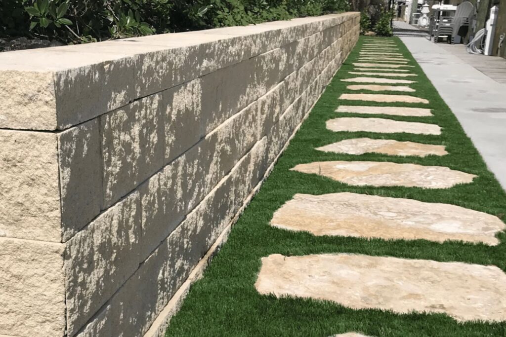 Retaining Wall Services With Walkway Pup Pavers and Turf Florida